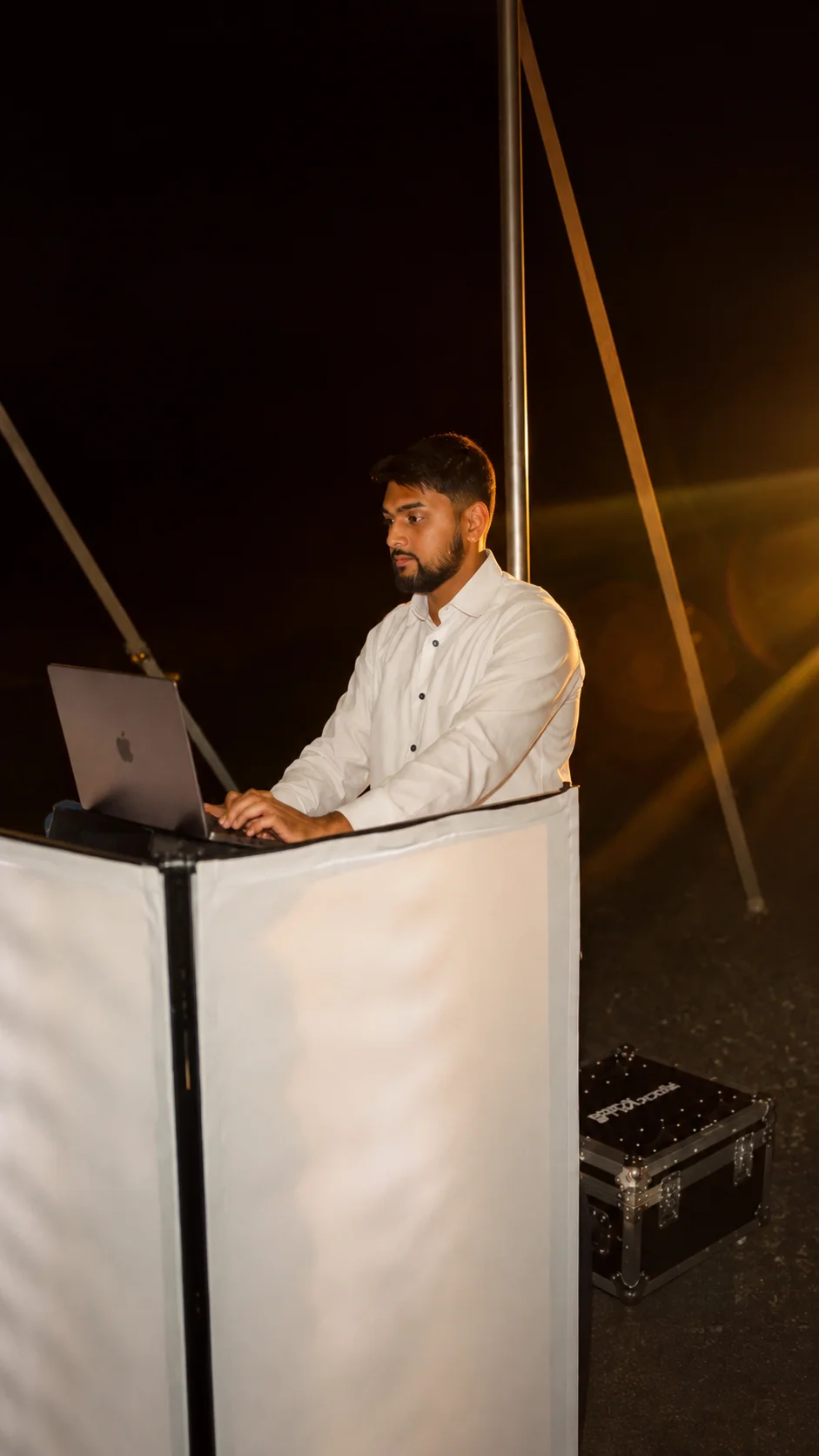 Dream Entertainment DJ at a white booth